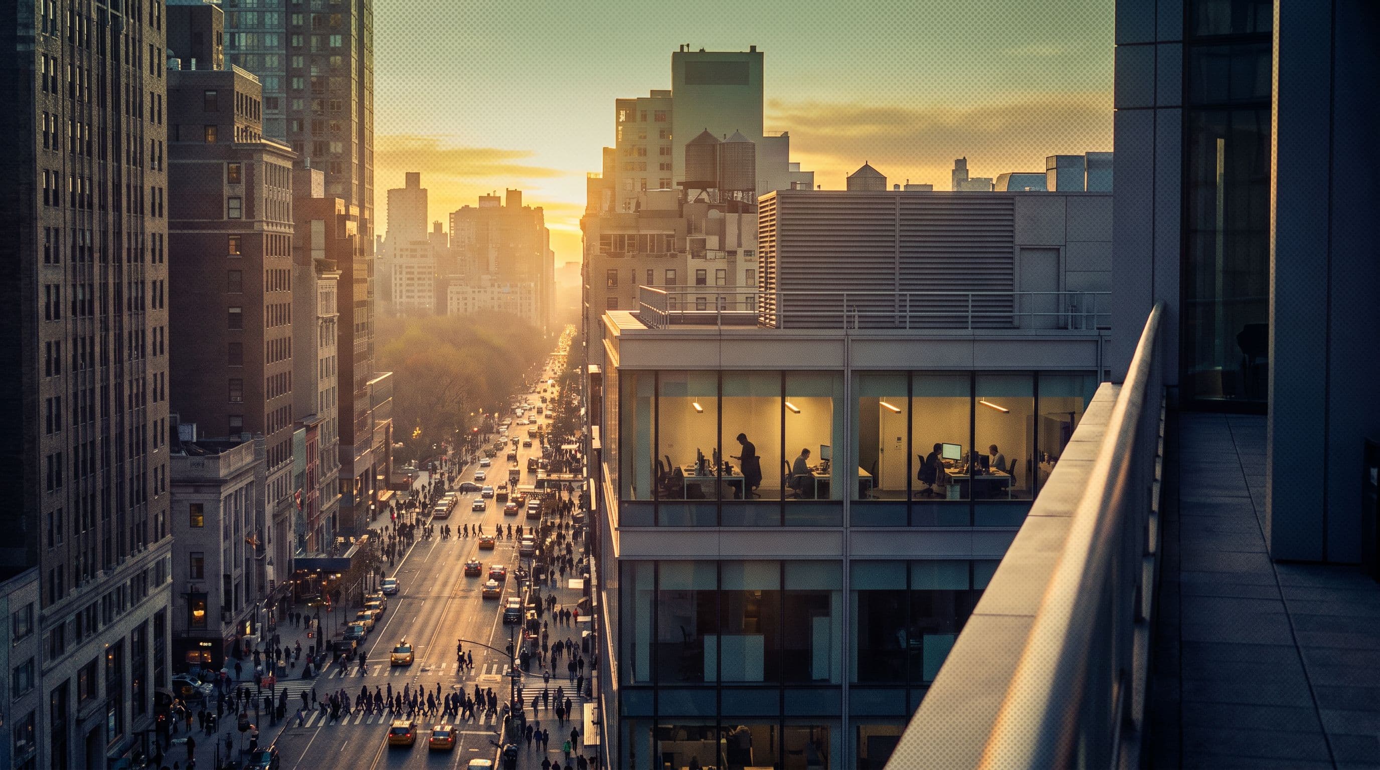 A team still working at their desks as the sun goes down over Manhattan
